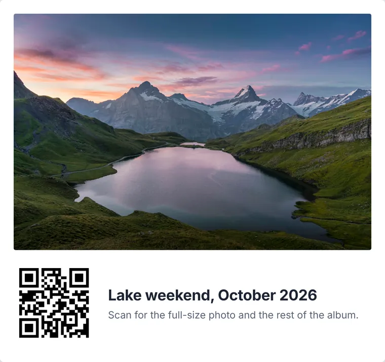A printed photo card of a mountain lake at sunset with a QR code and the words Scan for the full-size photo